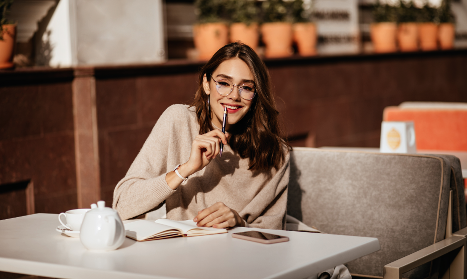 A girl writing a letter to practice IELTS