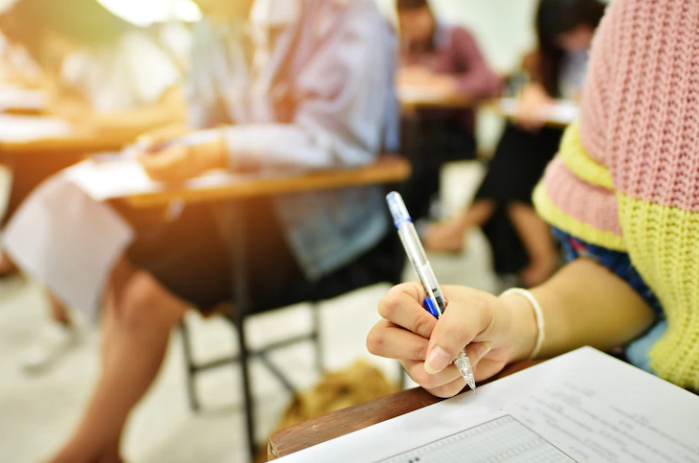 Several students are taking a Mock exam