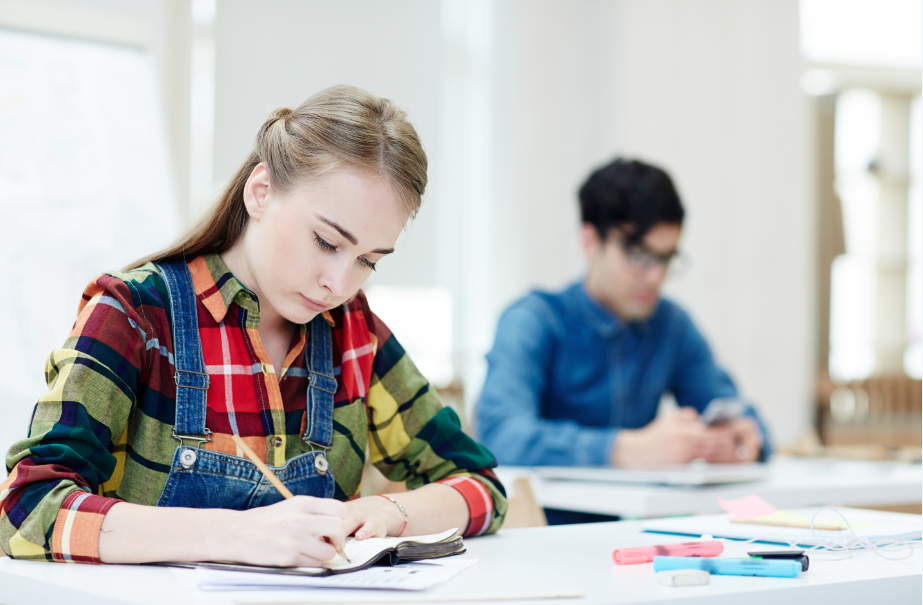 A girl taking an IELTS reading test