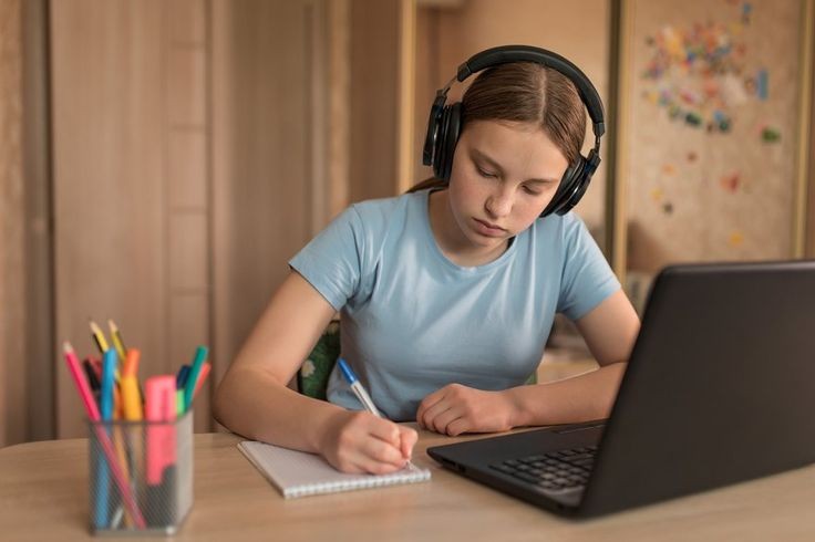 A girl practicing for an IELTS listening test