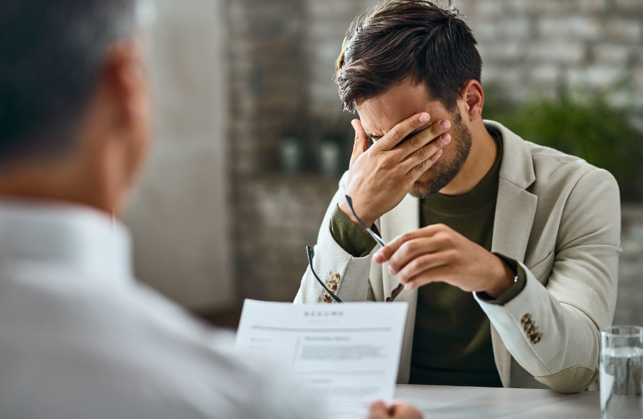 A man conducting a speaking interview and upset about the failure