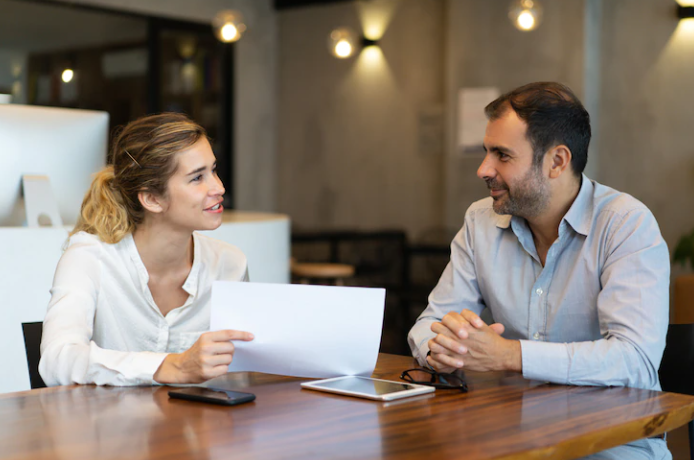 A man and a woman taking a speaking test