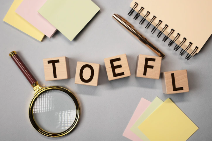 A picture with the word TOEFL written next to the notebook