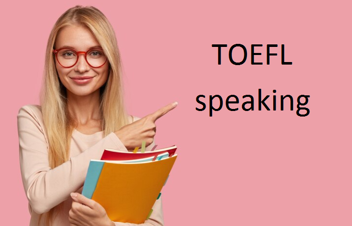 A beautiful girl who is showing the word Speaking TOEFL