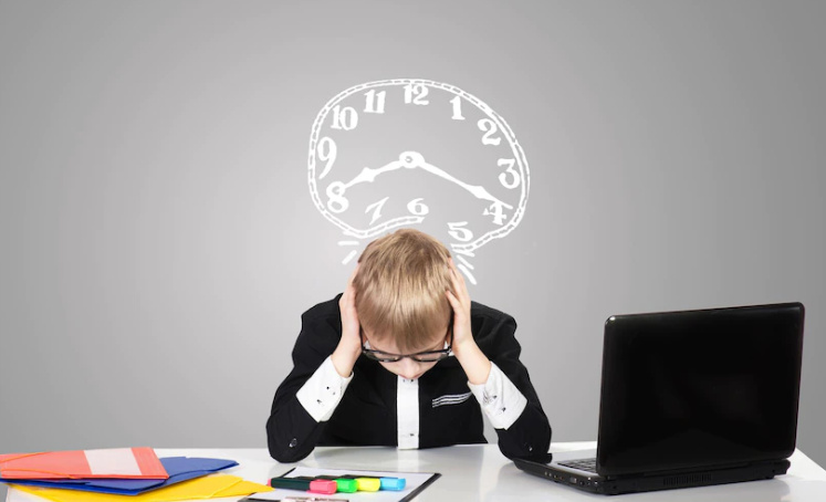 A boy who is upset and there is a clock above his head