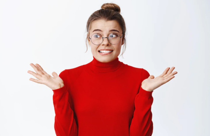 A girl in a red dress who is upset about making a mistake