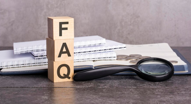 A picture in which the word FAQ is written on a stick