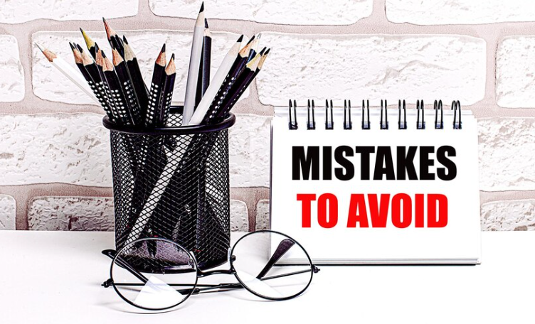 There are a number of pencils next to a sign that says Mistakes to avoid