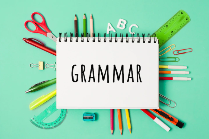 A photo with a green background on which the word grammar is written