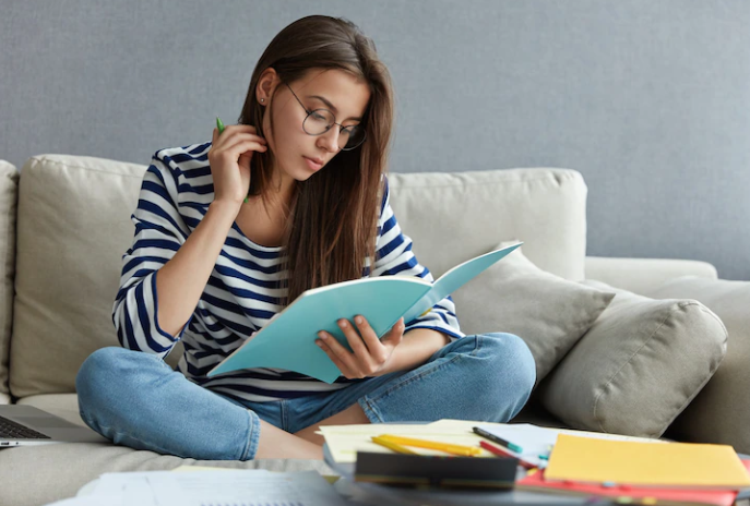 A girl is reading books