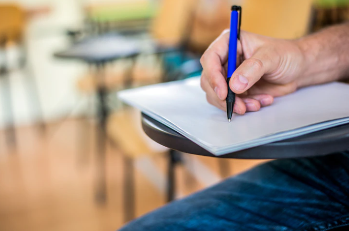 A man is testing with a pen